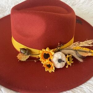Elegant Rust Hat with Yellow Band and Floral Accents